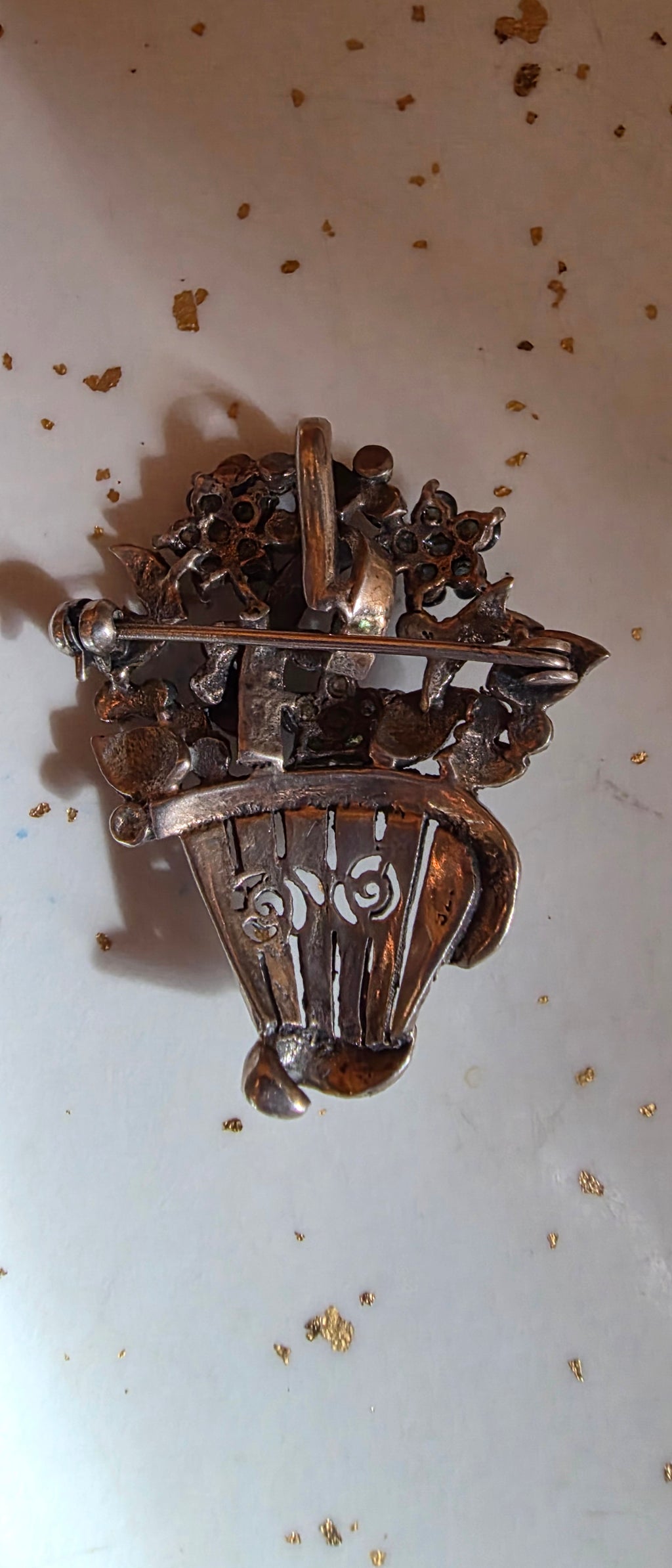 Sterling flower basket brooch (some stones missing)