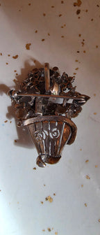 Sterling flower basket brooch (some stones missing)
