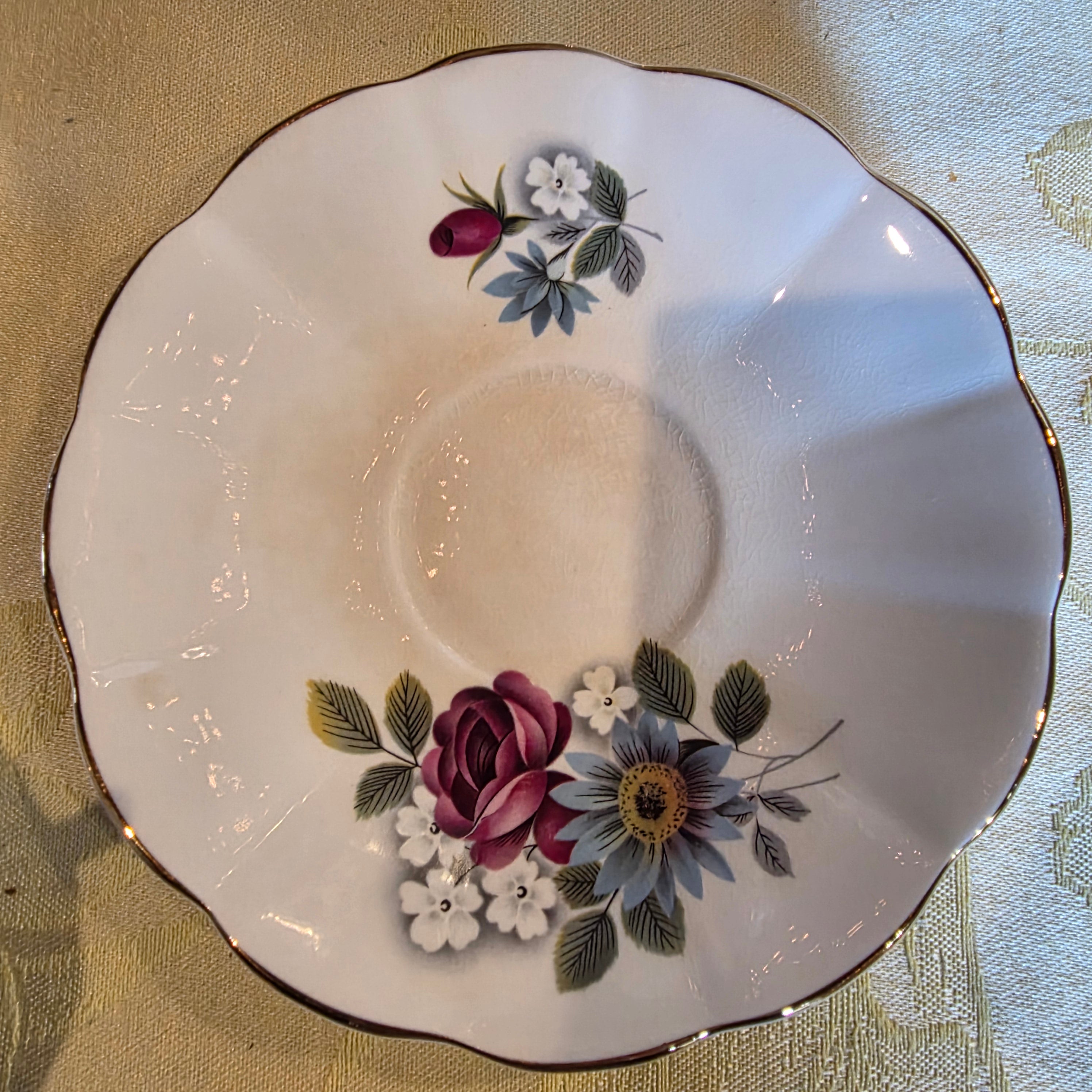 Vintage bone china cup & saucer made in England Floral Pattern and gold trim