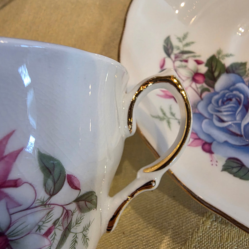 Vtg. Royal Vale Bone China cup & saucer blue rose and fuschia #7871