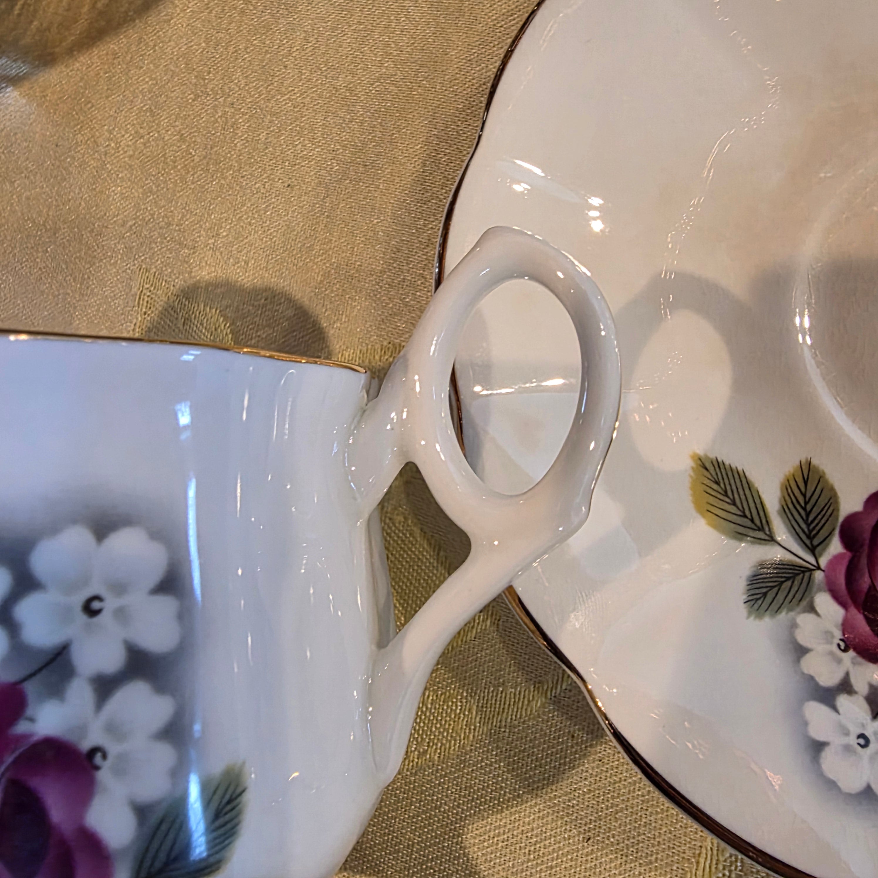 Vintage bone china cup & saucer made in England Floral Pattern and gold trim