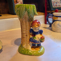 Girl by palm tree planter Japan