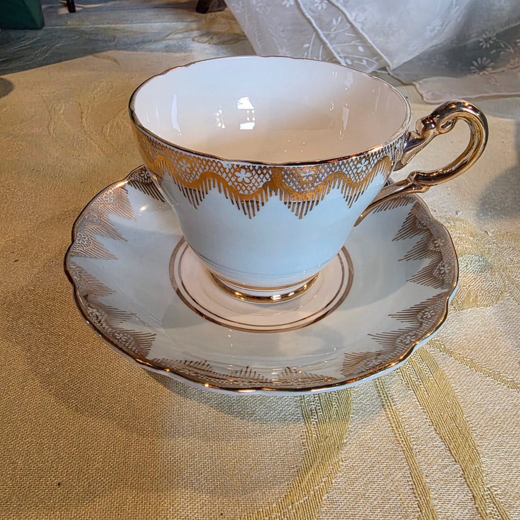 Vintage Regency Bone China cup & saucer gold filigree lace, light blue England
