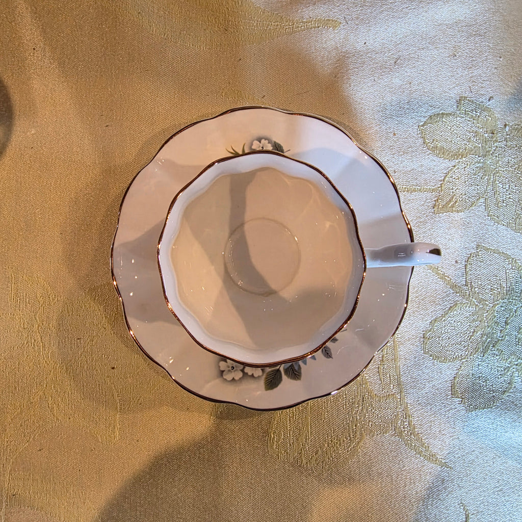 Vintage bone china cup & saucer made in England Floral Pattern and gold trim